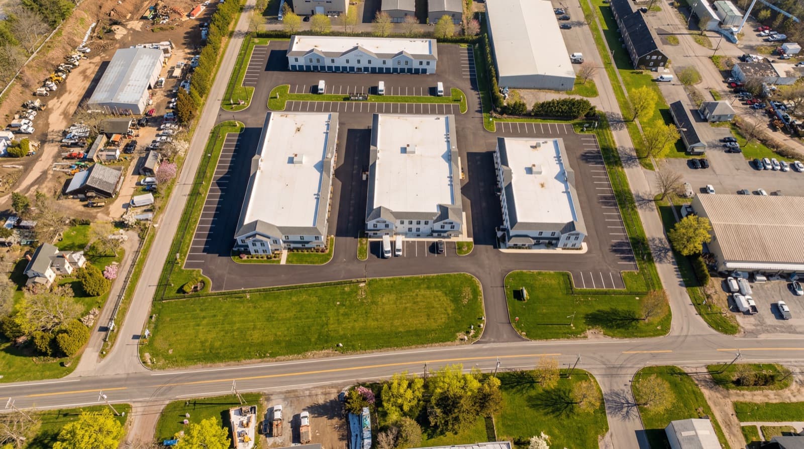 Aerial view of the gated Farrell Storage property with truck and trailer parking in Bridgehampton, NY